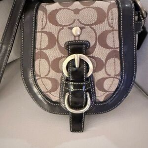 Coach Legacy Mini Garcia. Brown and Black Signature Canvas Saddle Crossbody